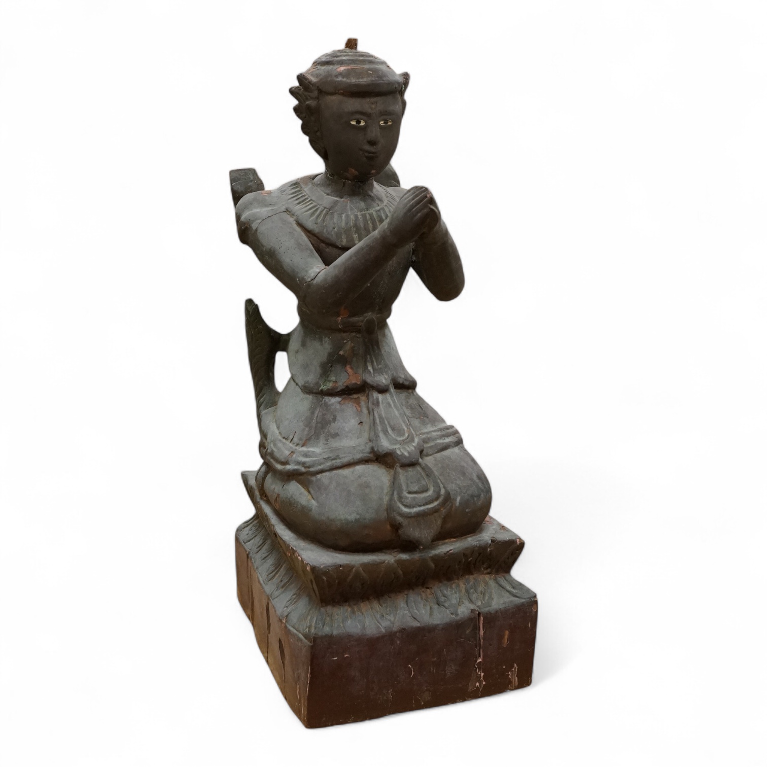 A Thai lacquered wood figure of a kneeling deity, 46cm high.